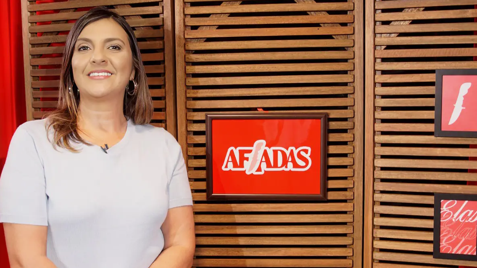 Afiadas presenter Adriana Barros wearing medium sized hair and white top looking at the camera