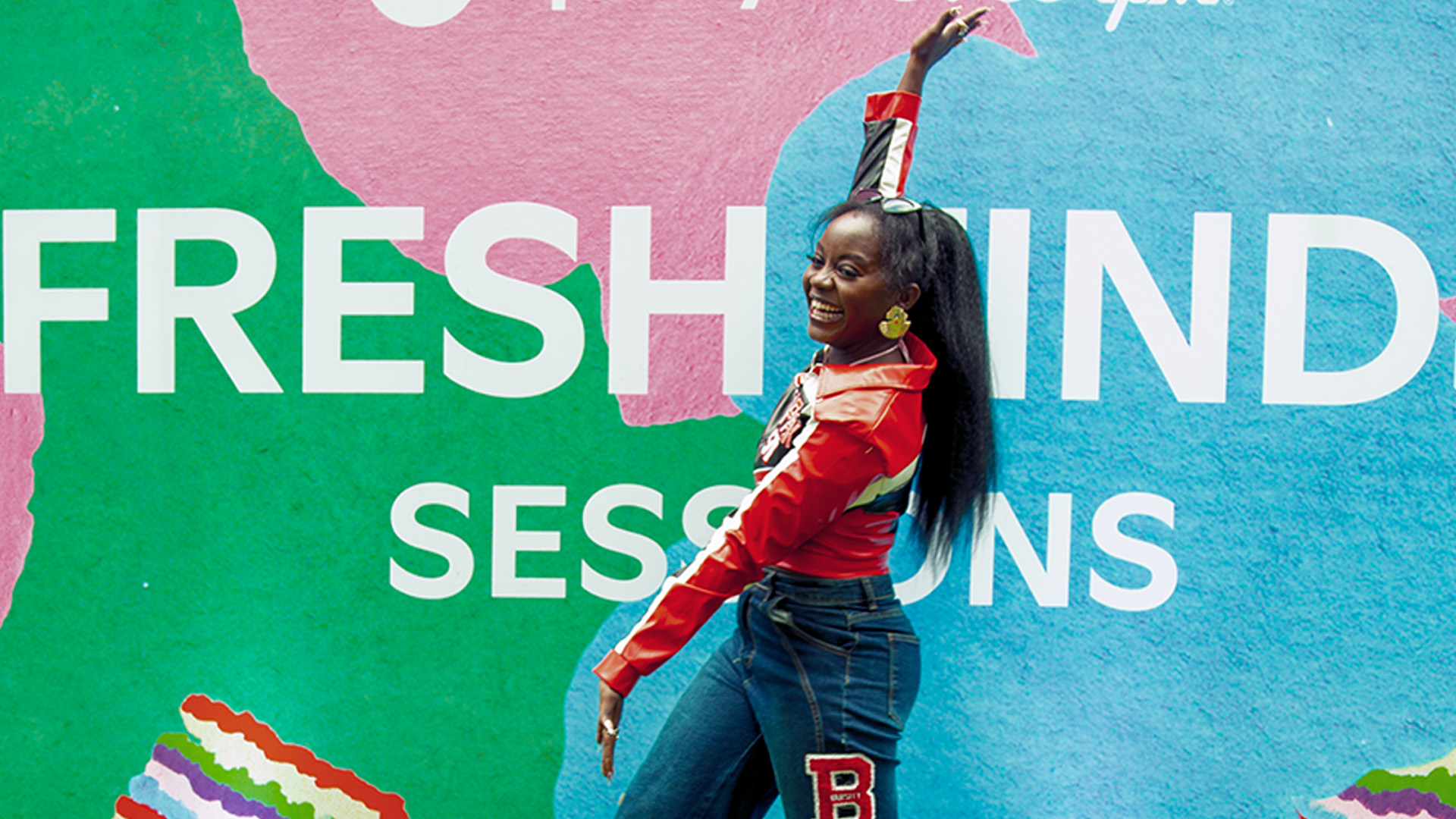Ilia Nia, a Fresh Find 2026 Class laureate, stands in front of a promotional plaque. ONErpm Kenya hosted the first ever East African edition of Spotify Fresh FInds