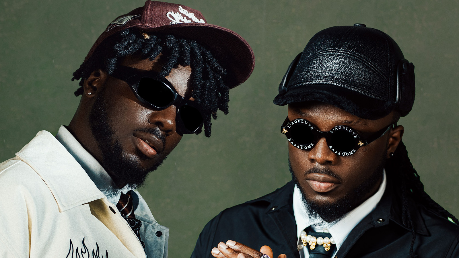 Ghanaian music duo formed by identical twin brothers Michael "B2" Boafo and Tony "Twist" Boafo wearing caps and sunglasses.