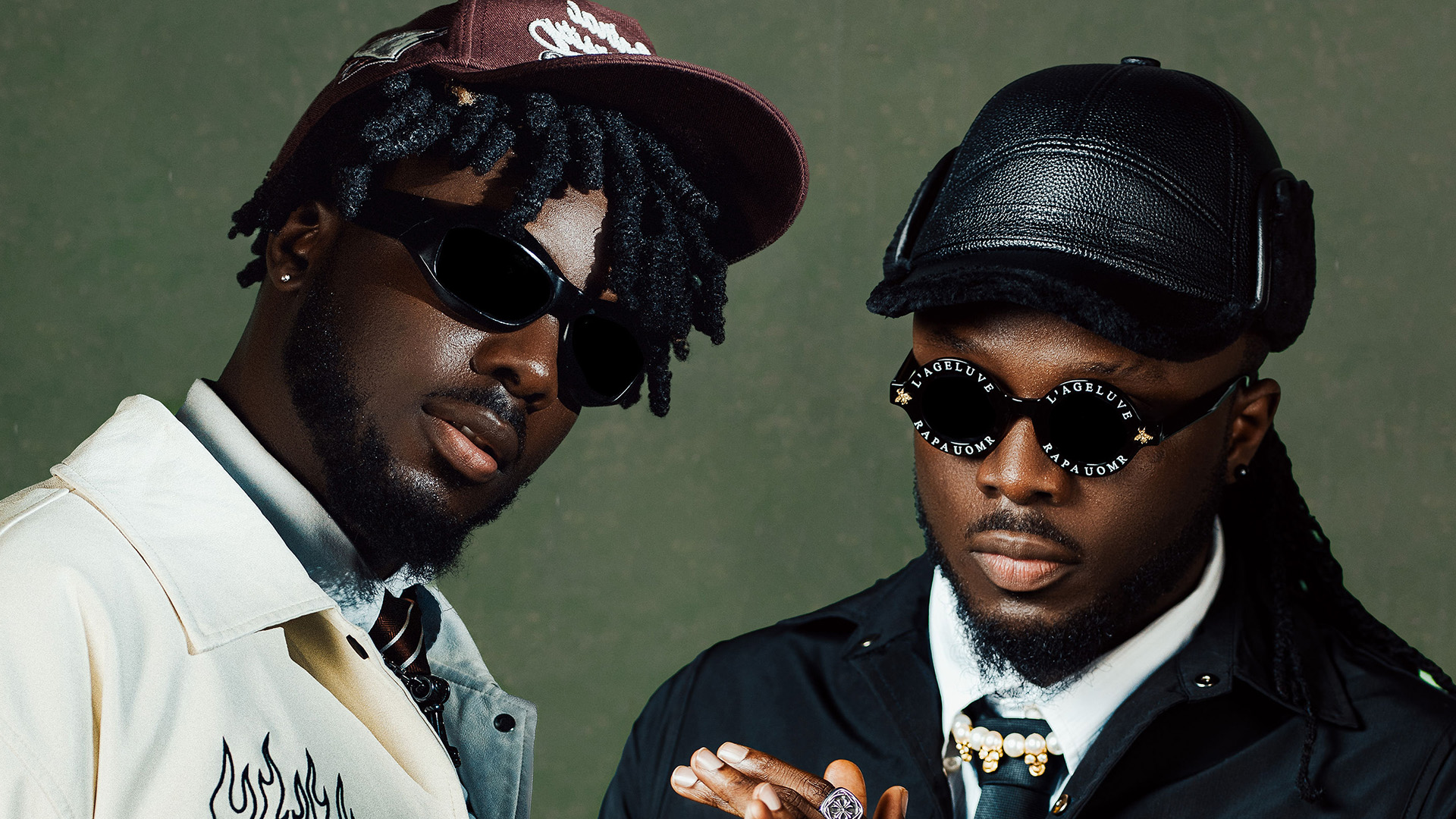 Ghanaian music duo formed by identical twin brothers Michael "B2" Boafo and Tony "Twist" Boafo wearing caps and sunglasses.